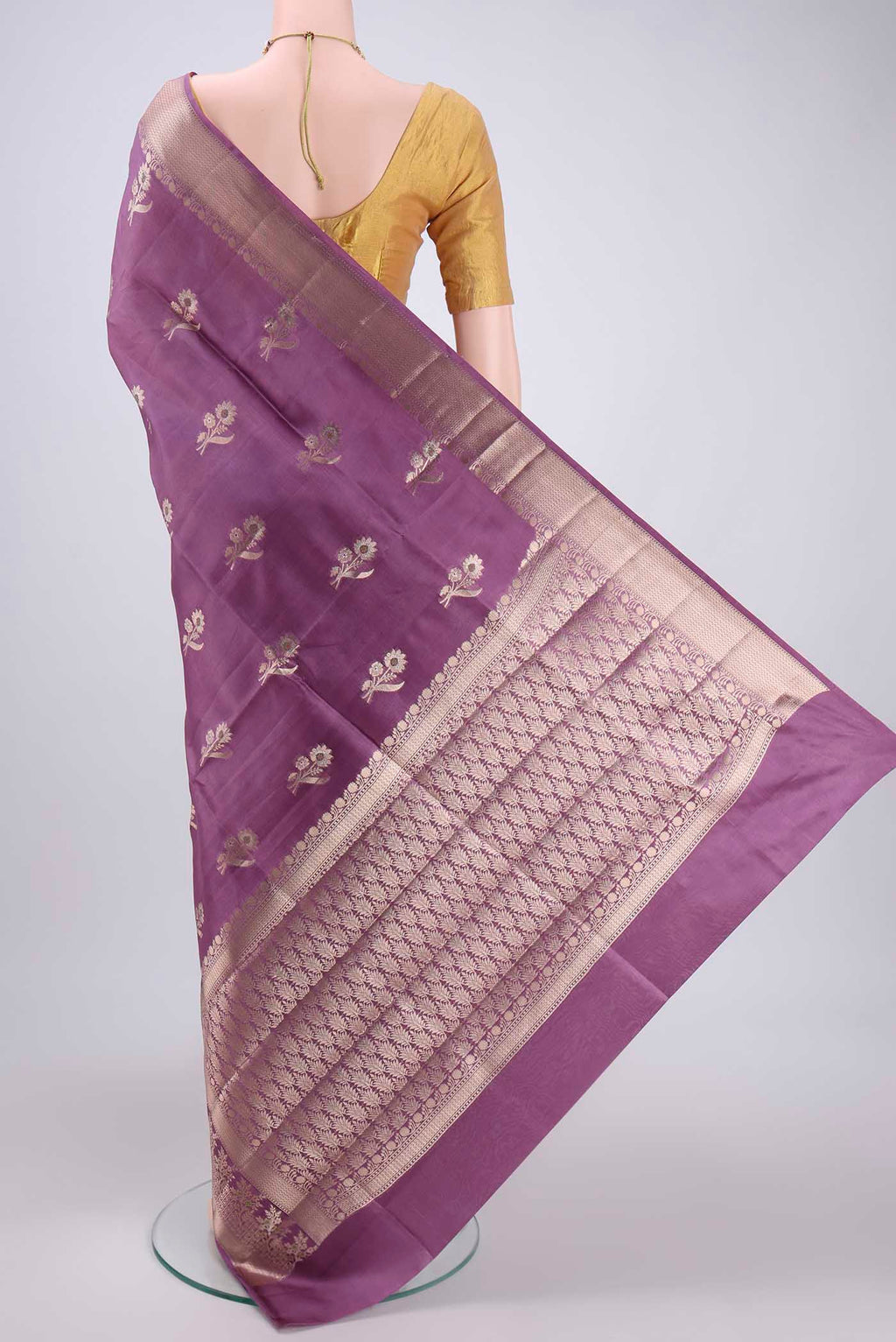 Flat view of Mauve Banarasi Raw Silk Saree with Zari Butta on the body and Zari Border. 
