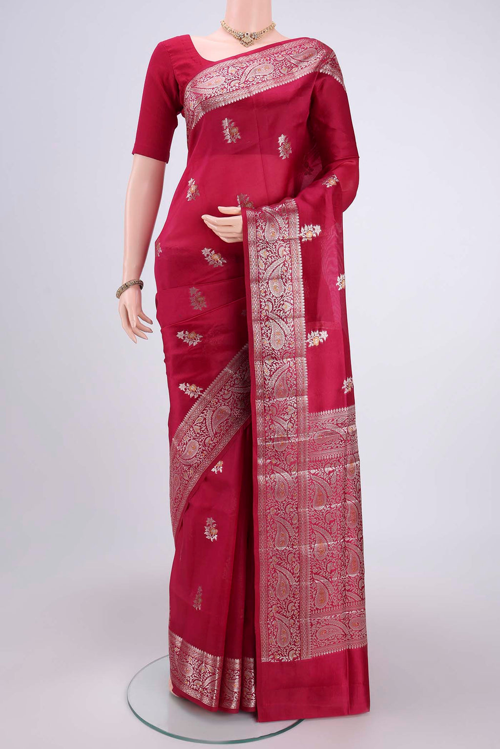 Dark Pink Banarasi Raw Silk Saree with Zari Butta on the body and Zari Border.  displayed on a mannequin