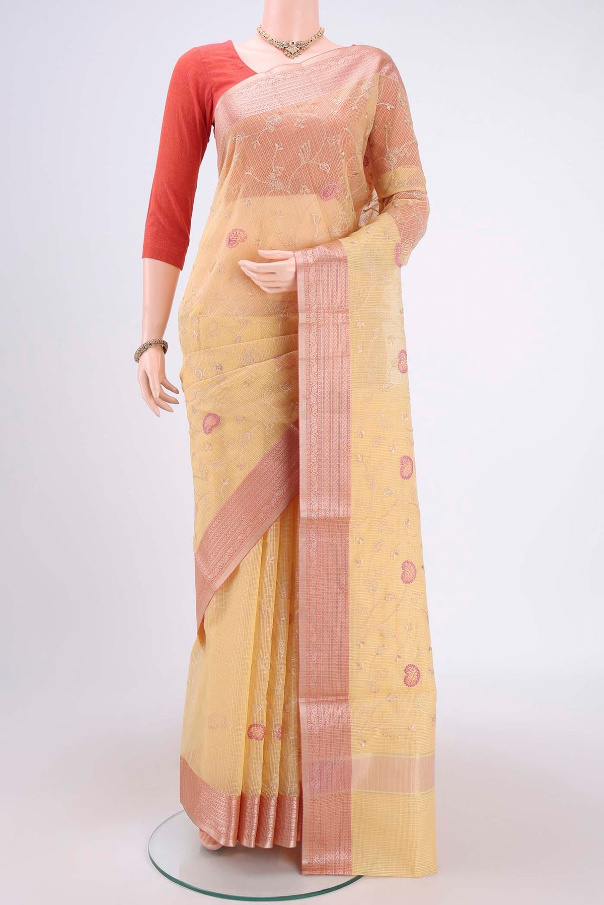 Yellow Coimbatore Silk Cotton Saree with Embroidery on the body and Plain Border.  displayed on a mannequin