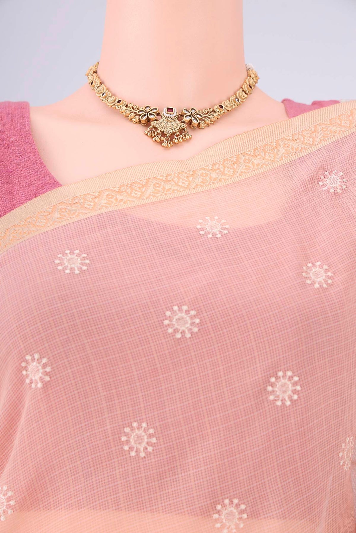 Border image of Peach Blended Kota Cotton Saree with Embroidery on the body and Thread Border. 