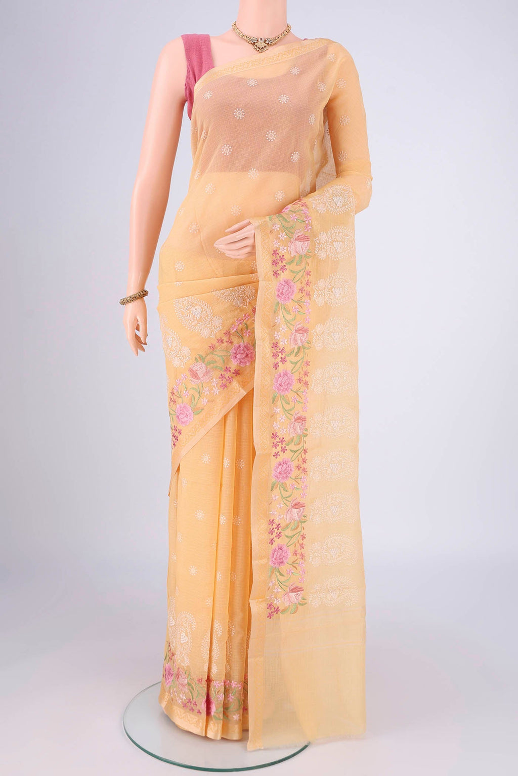 Sandal Blended Kota Cotton Saree with Embroidery on the body and Thread Border.  displayed on a mannequin