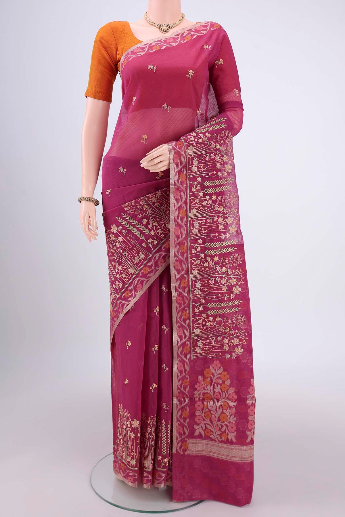 Dark Pink Kota Cotton Saree with Embroidery on the body and Zari Border.  displayed on a mannequin