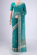 Sea Green Blended Kota Cotton Saree with Embroidery on the body and Zari Border.  displayed on a mannequin