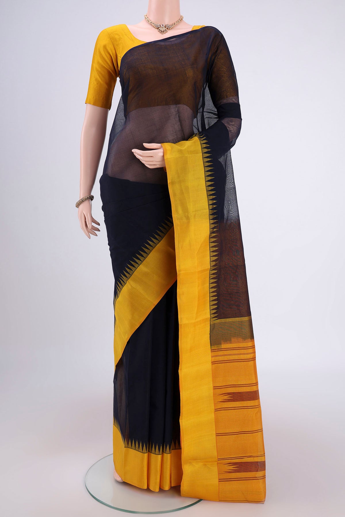 Navy Blue Kanchi Cotton Saree with Plain Body and Silk Border.  displayed on a mannequin