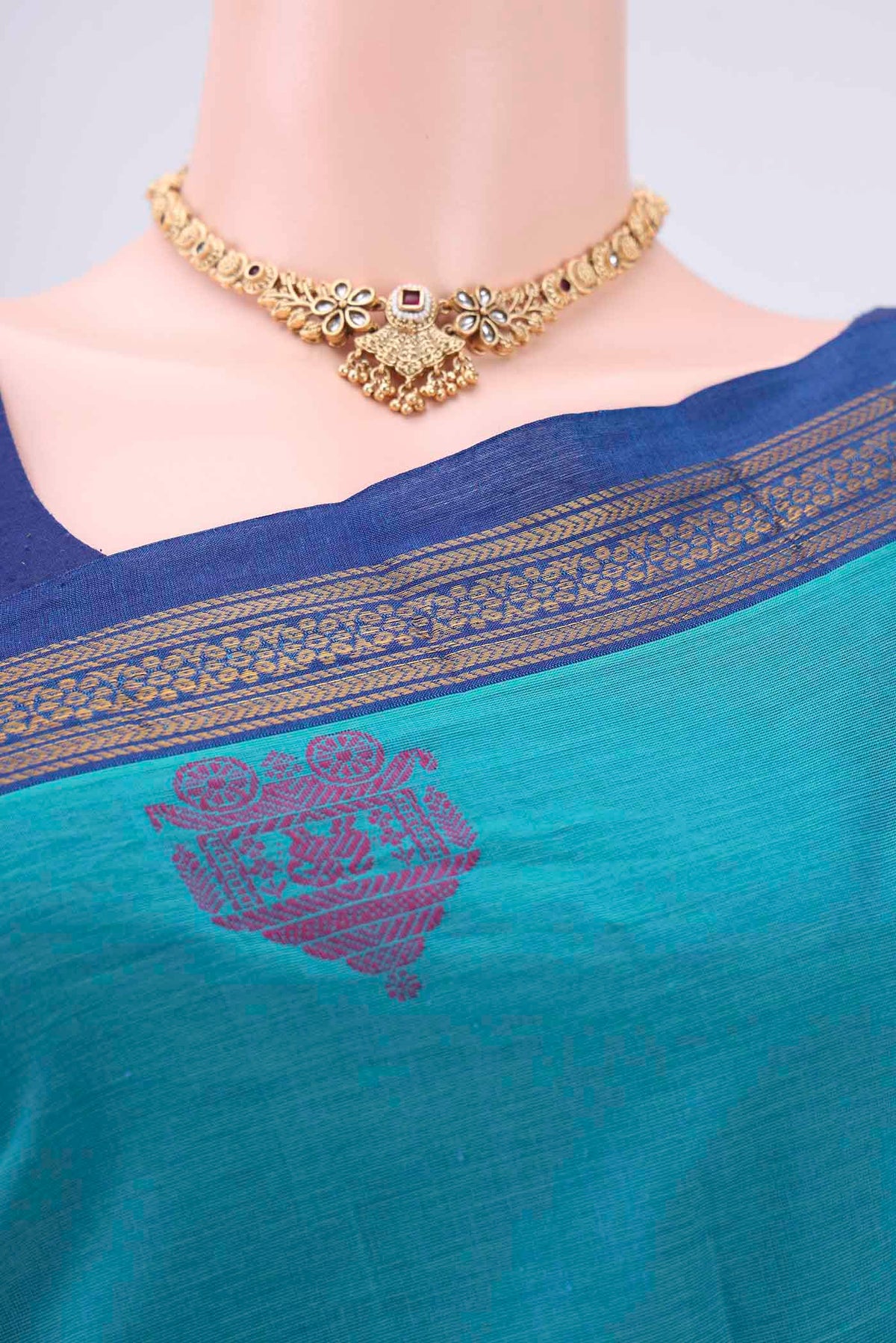 Border image of Turquoise Kanchi Cotton Saree with Thread Butta on the body and Thread Border. 