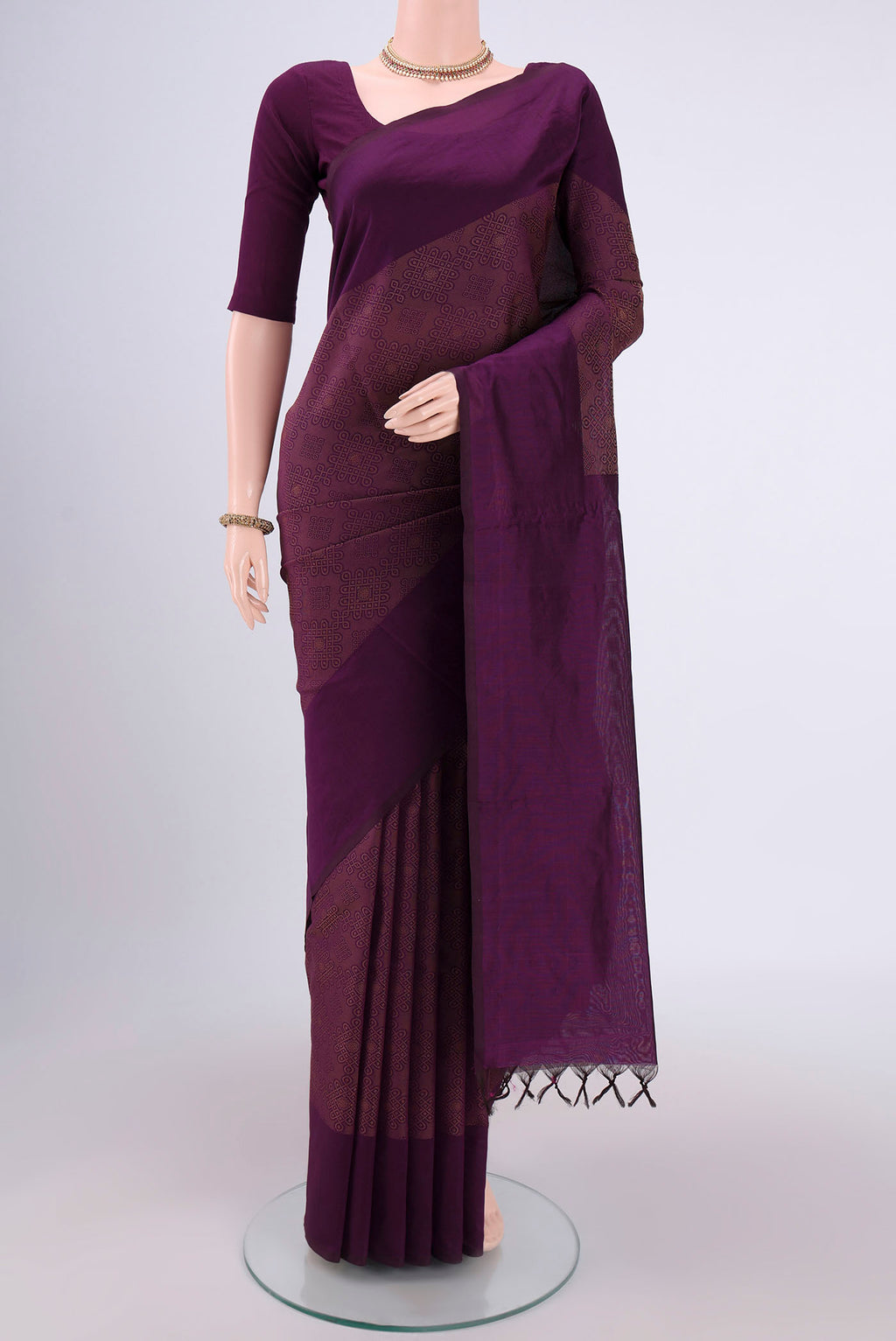 Purple Blended Poly Cotton Saree with Jacquard design on the body and Plain Border.  displayed on a mannequin