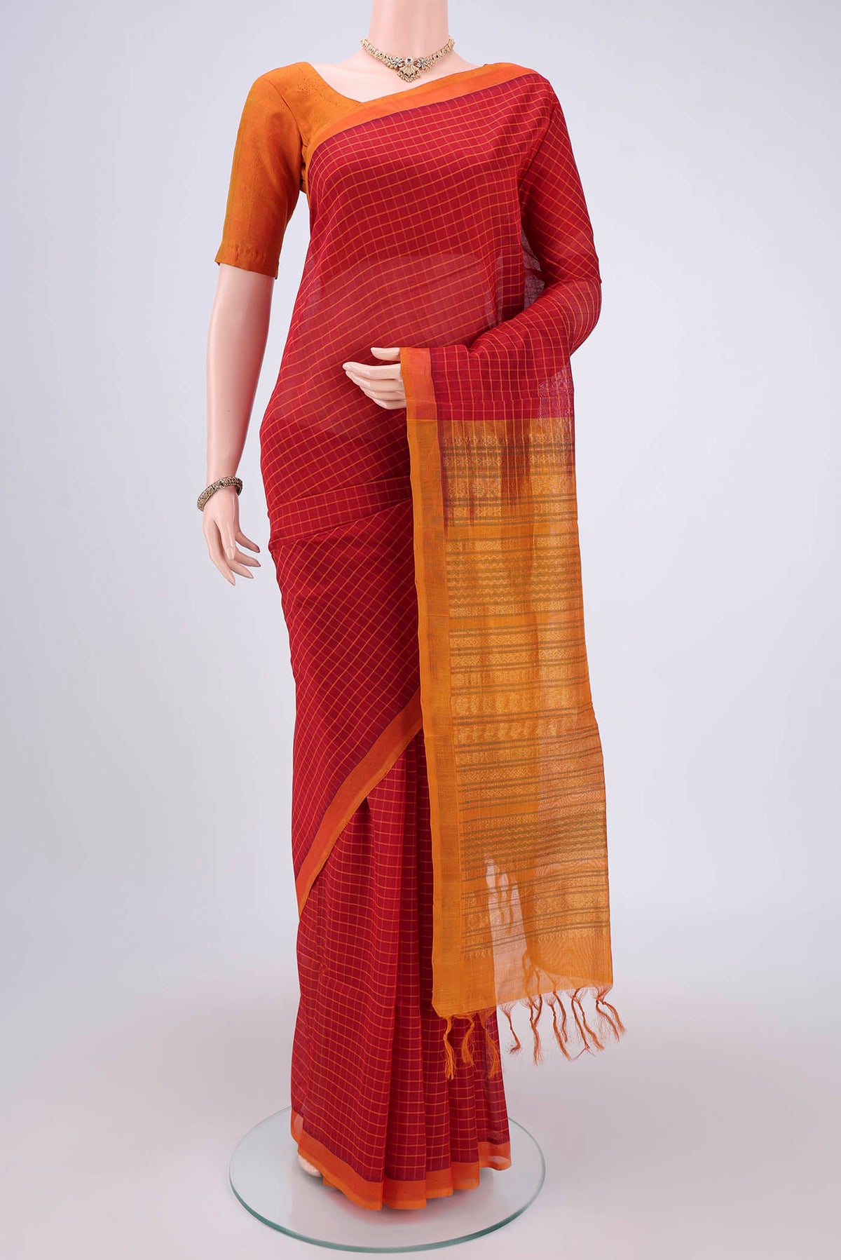 Red Coimbatore Silk Cotton Saree with Stripes on the body and Plain Border.  displayed on a mannequin