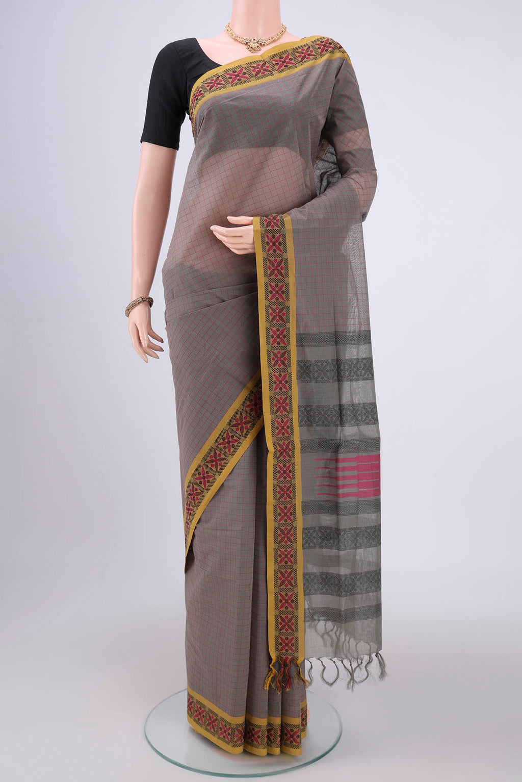 Grey Coimbatore Cotton Saree with Stripes on the body and Thread Border.  displayed on a mannequin