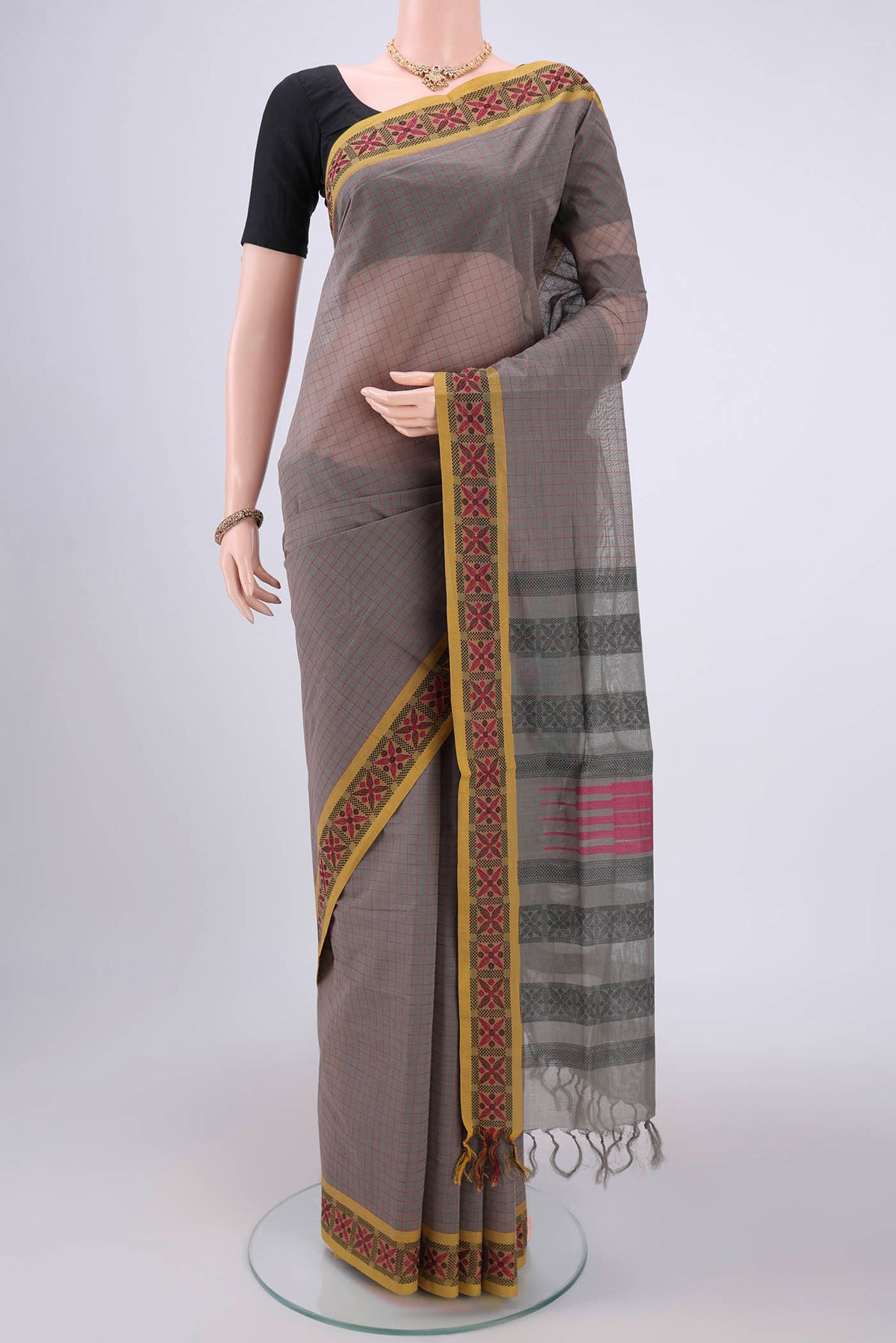 Grey Coimbatore Cotton Saree with Stripes on the body and Thread Border.  displayed on a mannequin