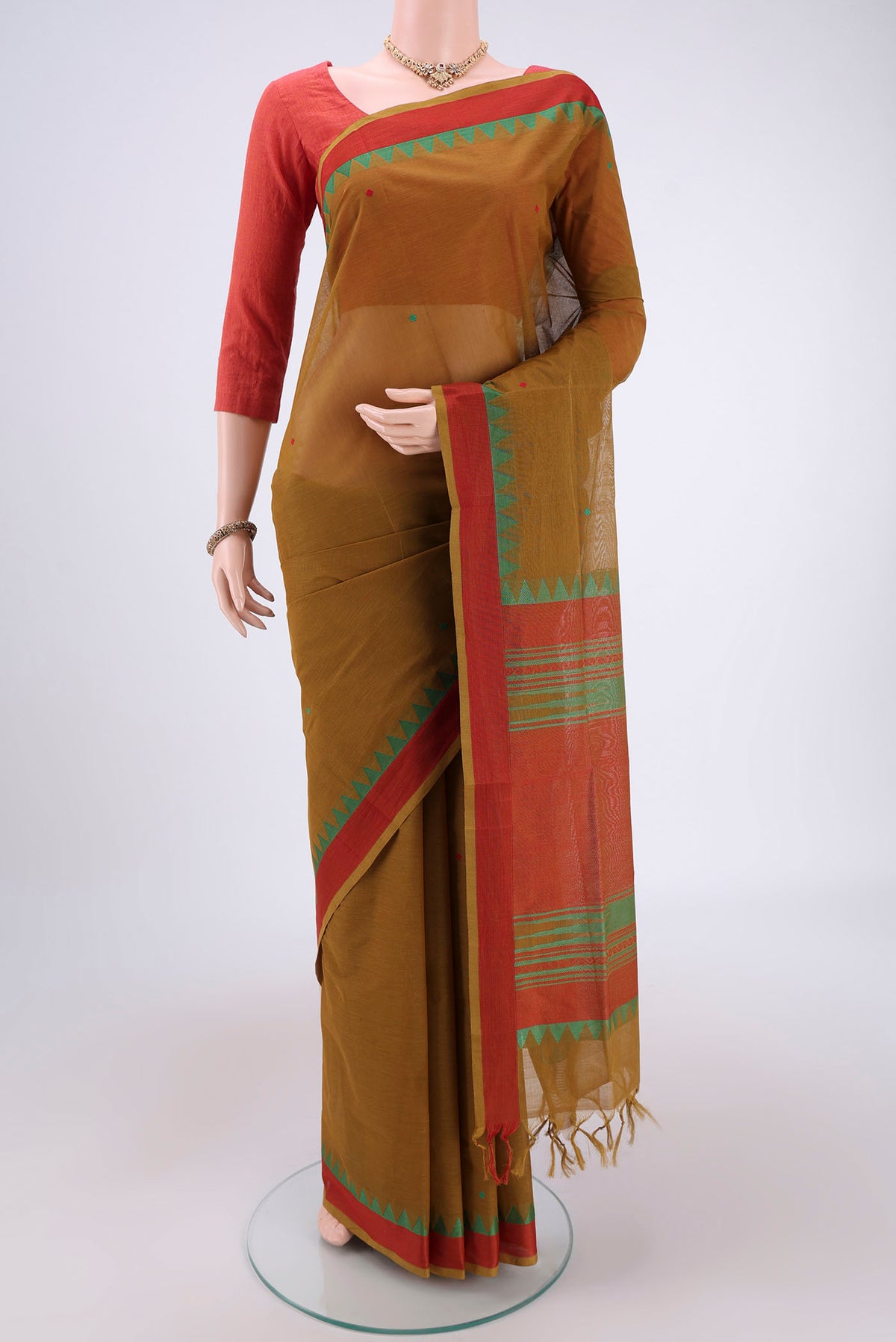 Mehandi Green Coimbatore Cotton Saree with Stripes on the body and Thread Border.  displayed on a mannequin