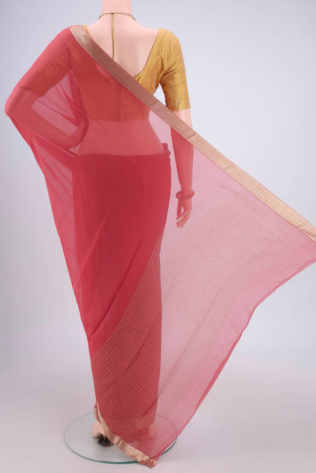 Flat view of Peach Mysore Chiffon Saree with Plain Body and Zari Border. 