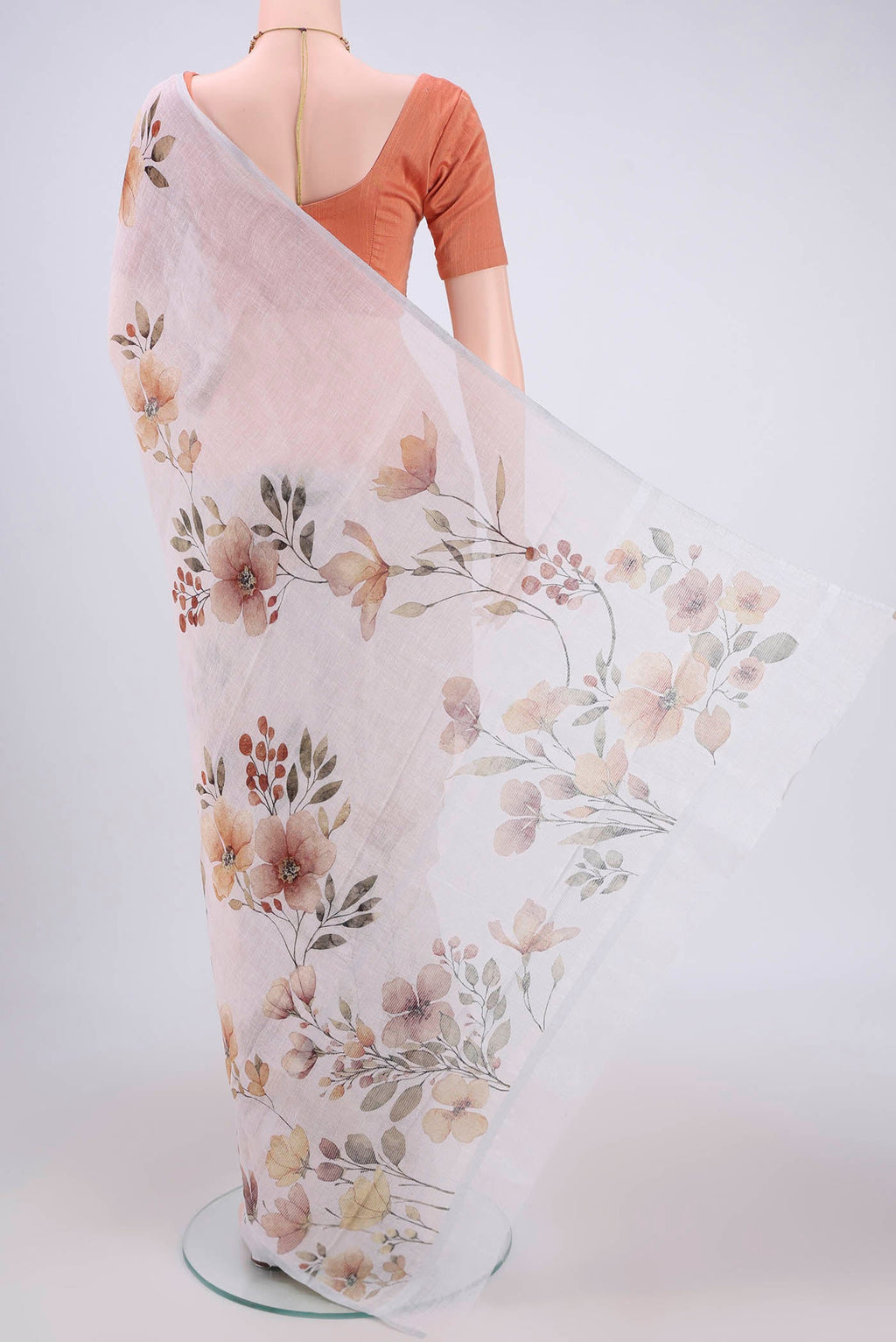 Flat view of Off White Linen Saree with Floral Print on the body and Zari Border. 