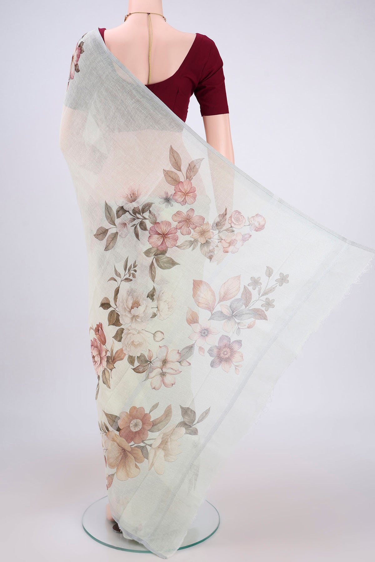 Flat view of Pista Green Linen Saree with Floral Print on the body and Zari Border. 