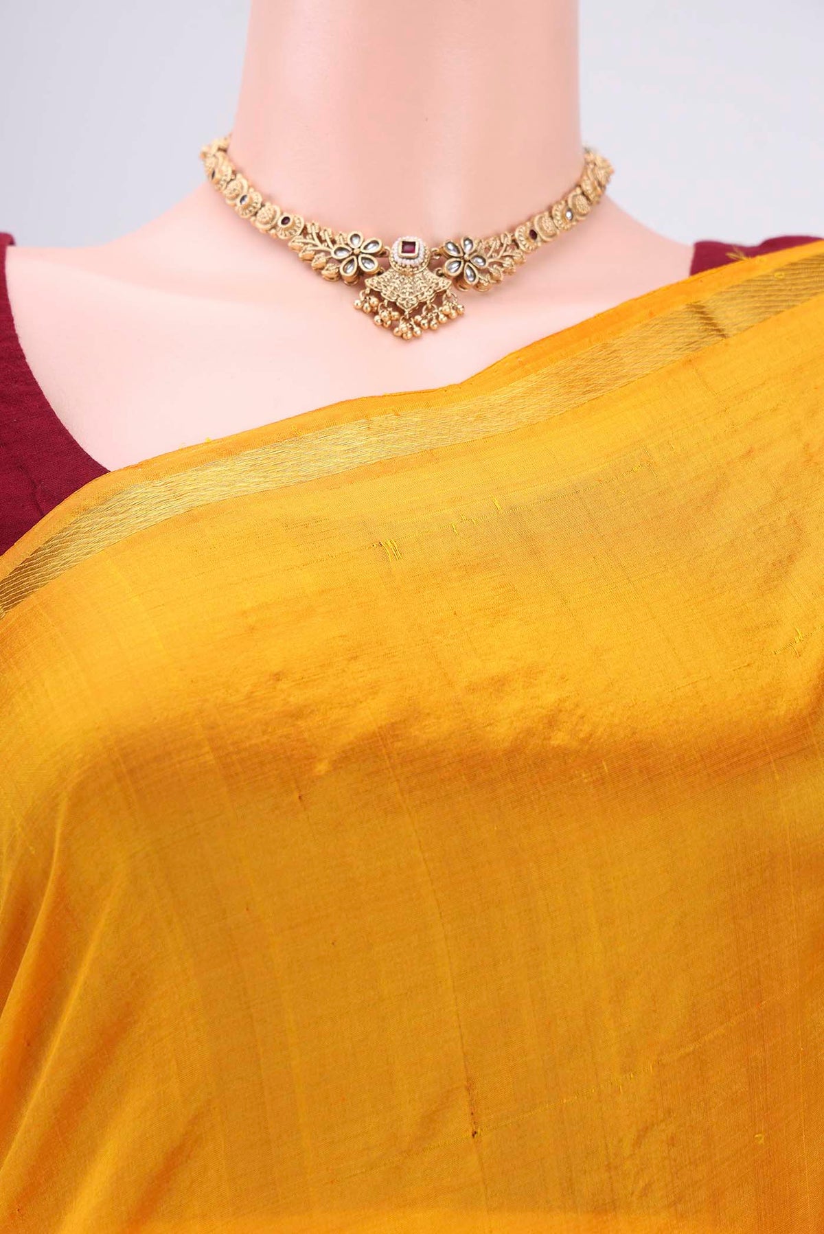 Border image of Mustard Kanchipuram Silk Saree with Plain Body and Thread Border. 