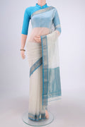 Off White Maheshwari Silk Cotton Saree with Zari Butta on the body and Zari Border.  displayed on a mannequin
