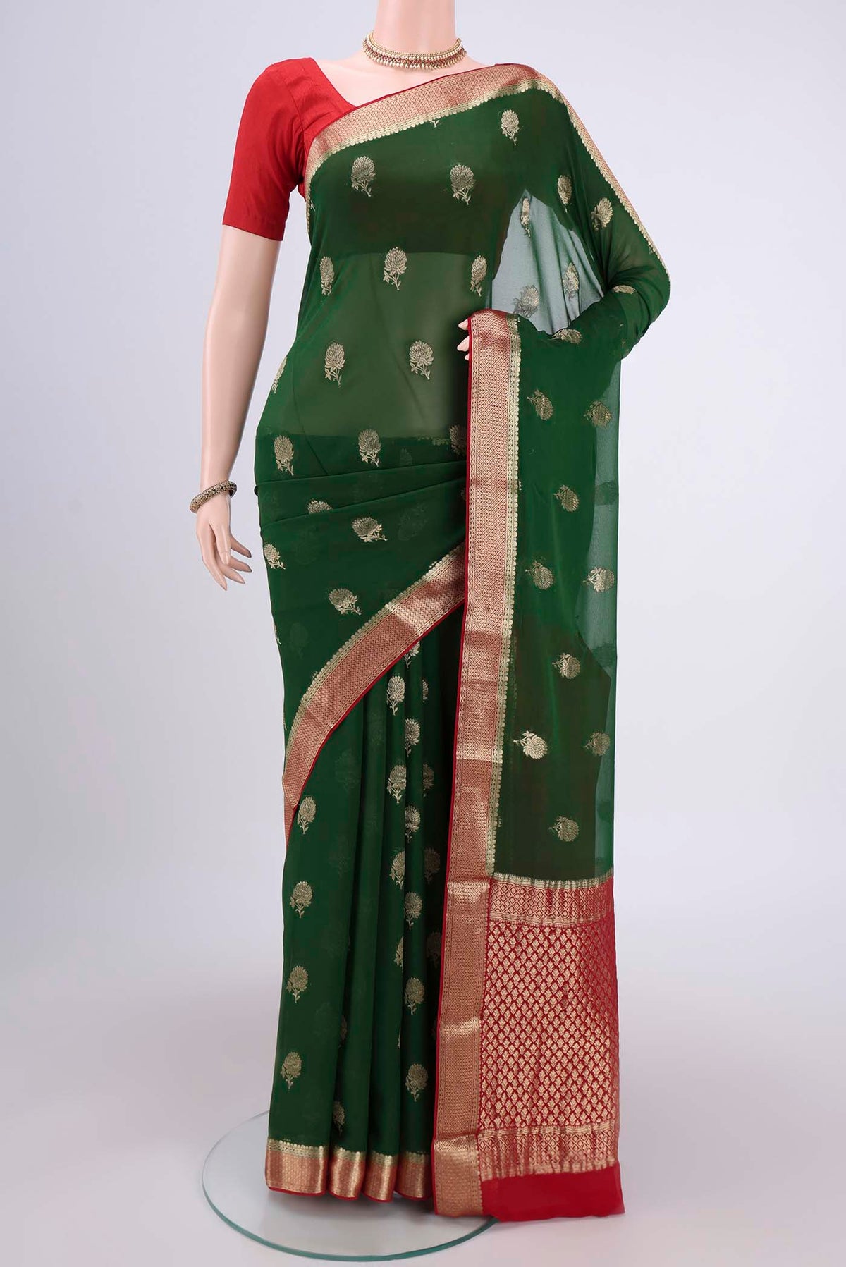 Green Dual Tone Mysore Georgette Saree with Zari Butta on the body and Zari Border.  displayed on a mannequin