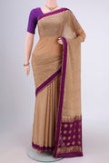Dark Beige Mysore Chiffon Saree with Zari Butta on the body and Zari Border.  displayed on a mannequin