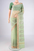 Light Green Blended Kota Cotton Saree with Embroidery on the body and Zari Border.  displayed on a mannequin