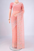 Peach Blended Kota Cotton Saree with Embroidery on the body and Thread Border.  displayed on a mannequin