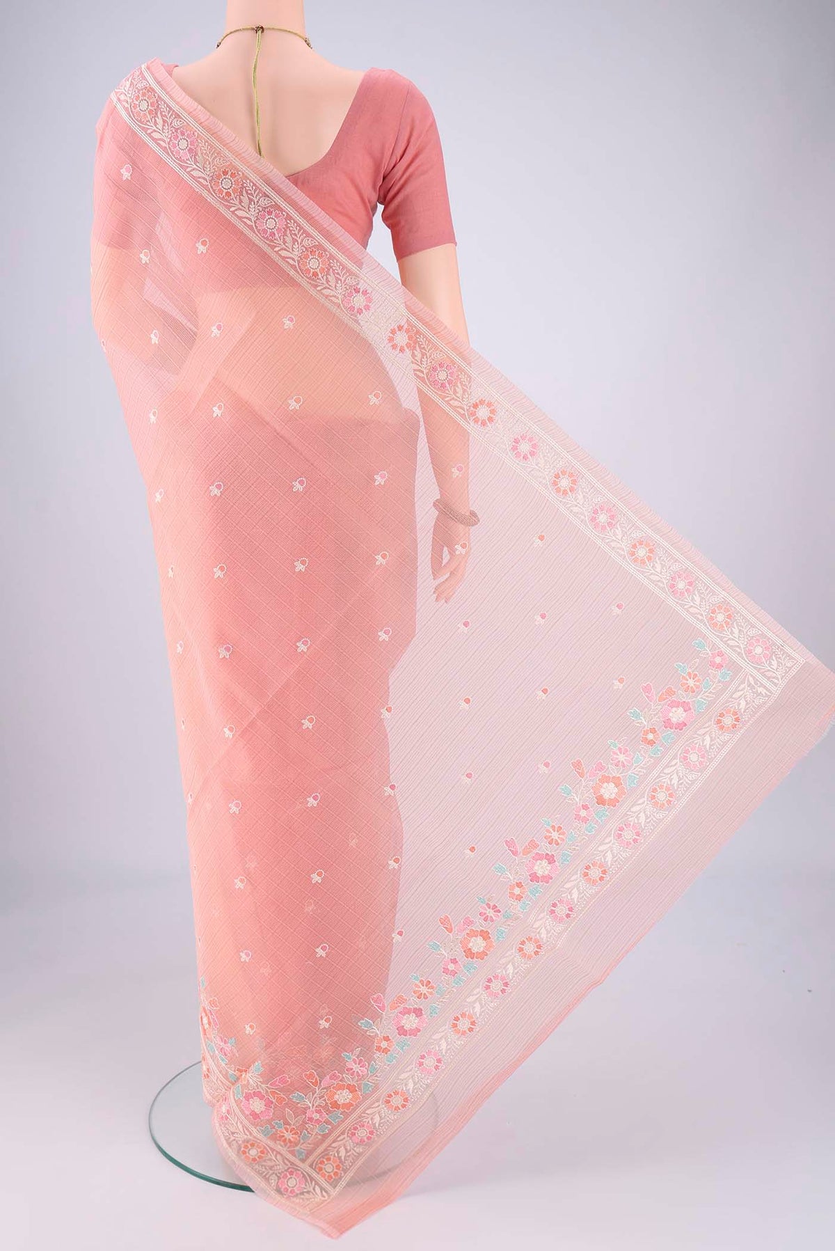 Flat view of Peach Blended Kota Cotton Saree with Embroidery on the body and Thread Border. 