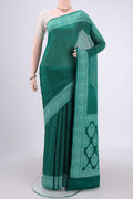 Green Blended Banarasi Georgette Saree with Thread Butta on the body and Thread Border.  displayed on a mannequin