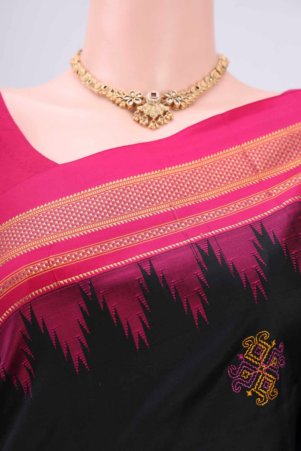 Border image of Black Bangalore Silk Saree with Embroidery on the body and Temple Border. 
