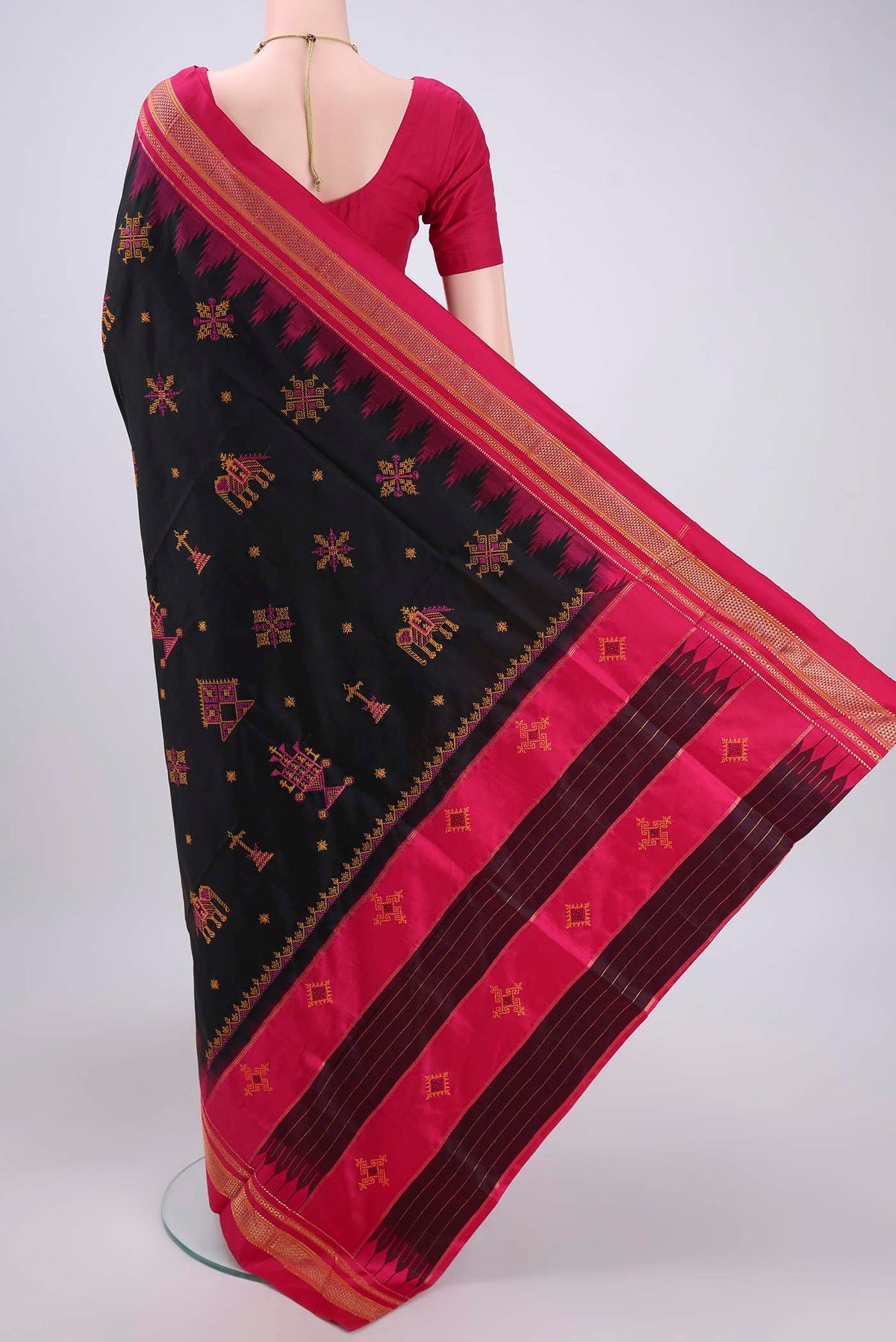 Flat view of Black Bangalore Silk Saree with Embroidery on the body and Temple Border. 