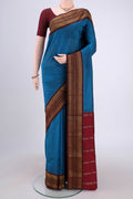 Dark Blue Blended Bangalore Silk Saree with Plain Body and Zari Border.  displayed on a mannequin