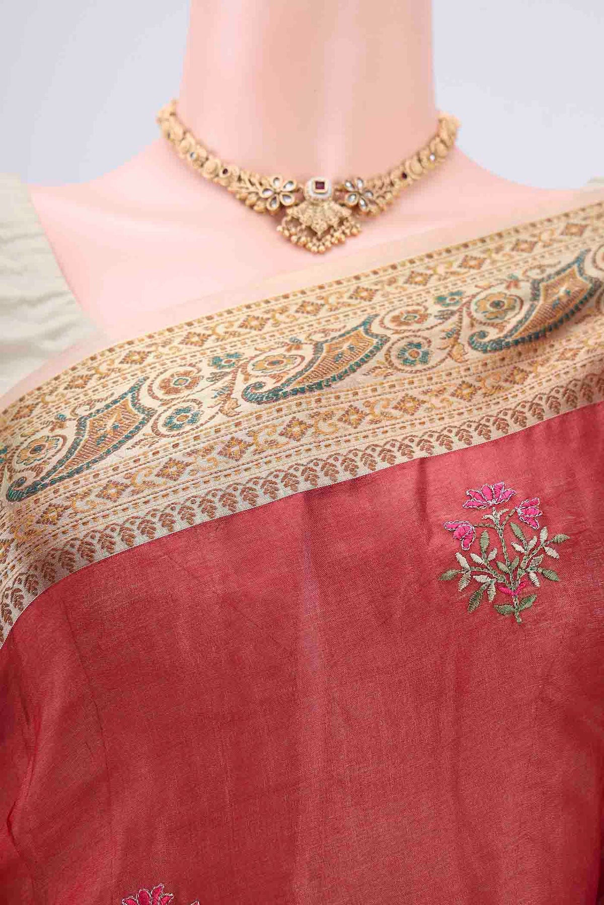 Border image of Maroon Banarasi Tussar Silk Saree with Embroidery on the body and Zari And Thread Border. 