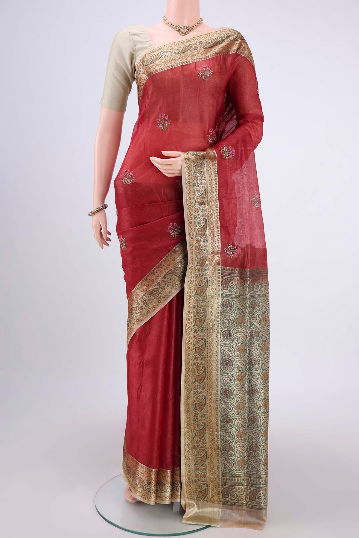Maroon Banarasi Tussar Silk Saree with Embroidery on the body and Zari And Thread Border.  displayed on a mannequin