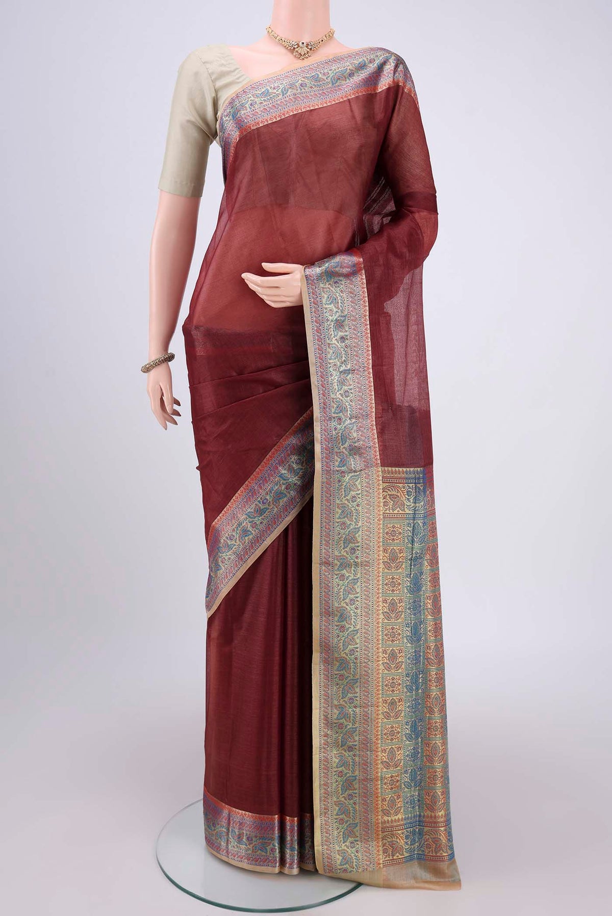 Brown Dual Tone Maheshwari Silk Cotton Saree with Plain Body and Zari Border.  displayed on a mannequin