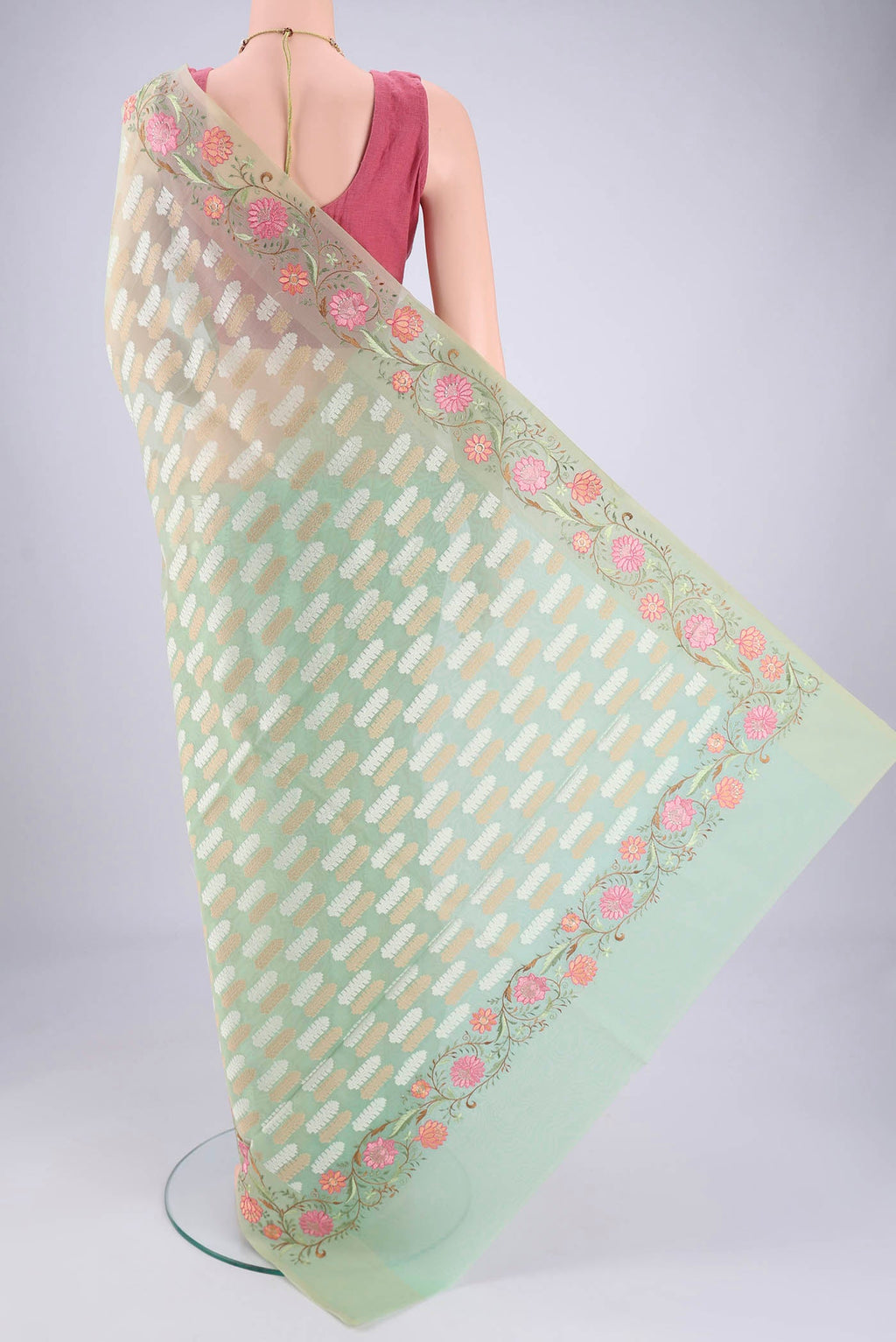 Flat view of Mint Green Blended Kota Cotton Saree with Embroidery on the body and Thread Border. 