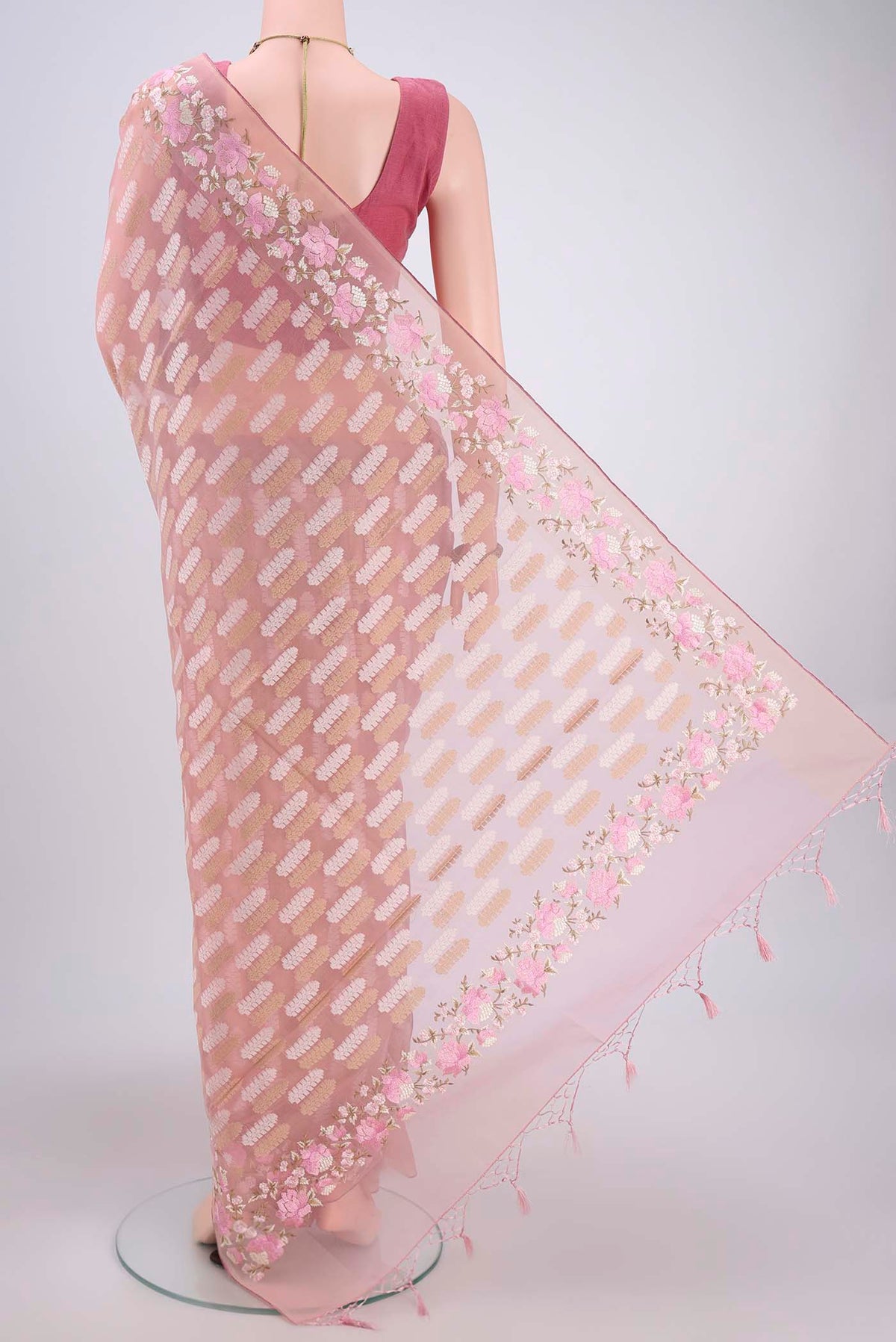 Flat view of Pink Kota Cotton Saree with Embroidery on the body and Zari Border. 