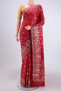 Orange Banarasi Tussar Silk Saree with Thread Brocade on the body and Zari And Thread Border.  displayed on a mannequin