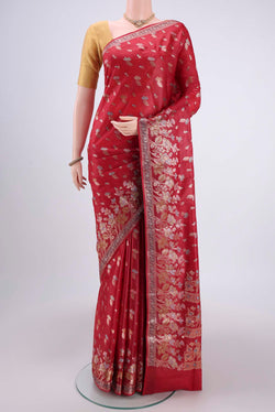 Orange Banarasi Tussar Silk Saree with Thread Brocade on the body and Zari And Thread Border.  displayed on a mannequin