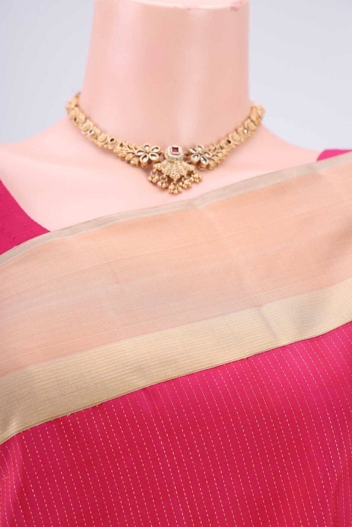 Border image of Pure Silk Pure Zari Rani Pink Dual Tone Kanjivaram Saree with Stripes on the body and Zari Border. 