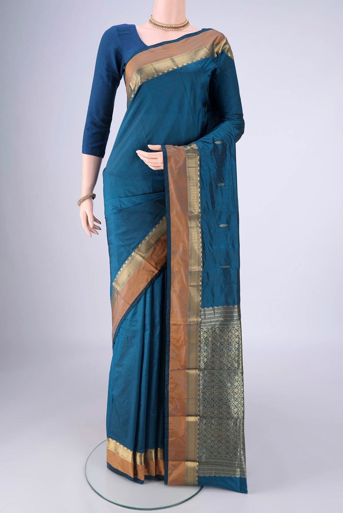 Blue Blended Bangalore Silk Saree with Zari Butta on the body and Zari Border.  displayed on a mannequin