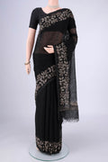 Black Linen Cotton Saree with Kantha Work on the body and Thread Border.  displayed on a mannequin