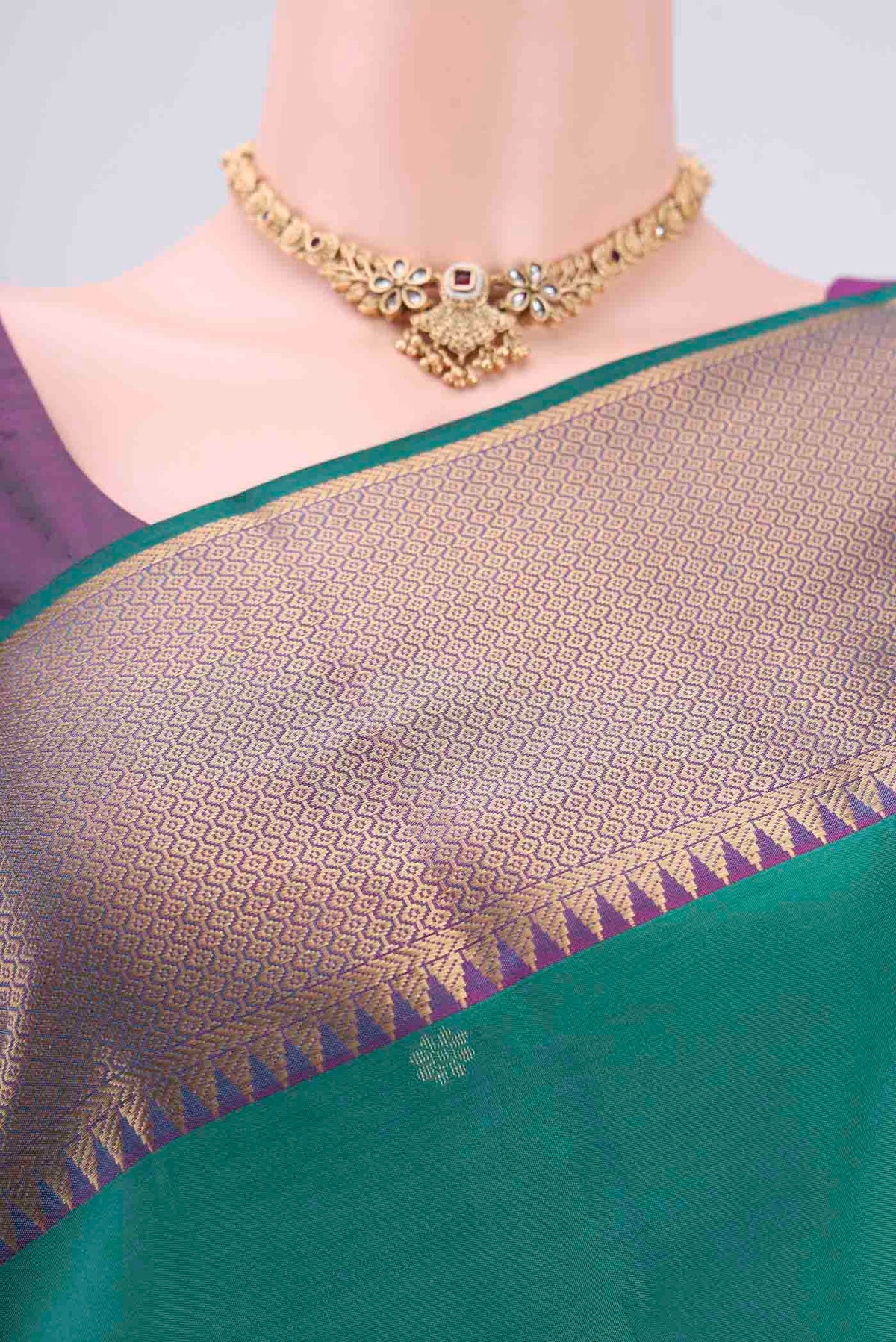 Border image of Green Kanchipuram Silk Saree with Zari Butta on the body and Zari Border. 