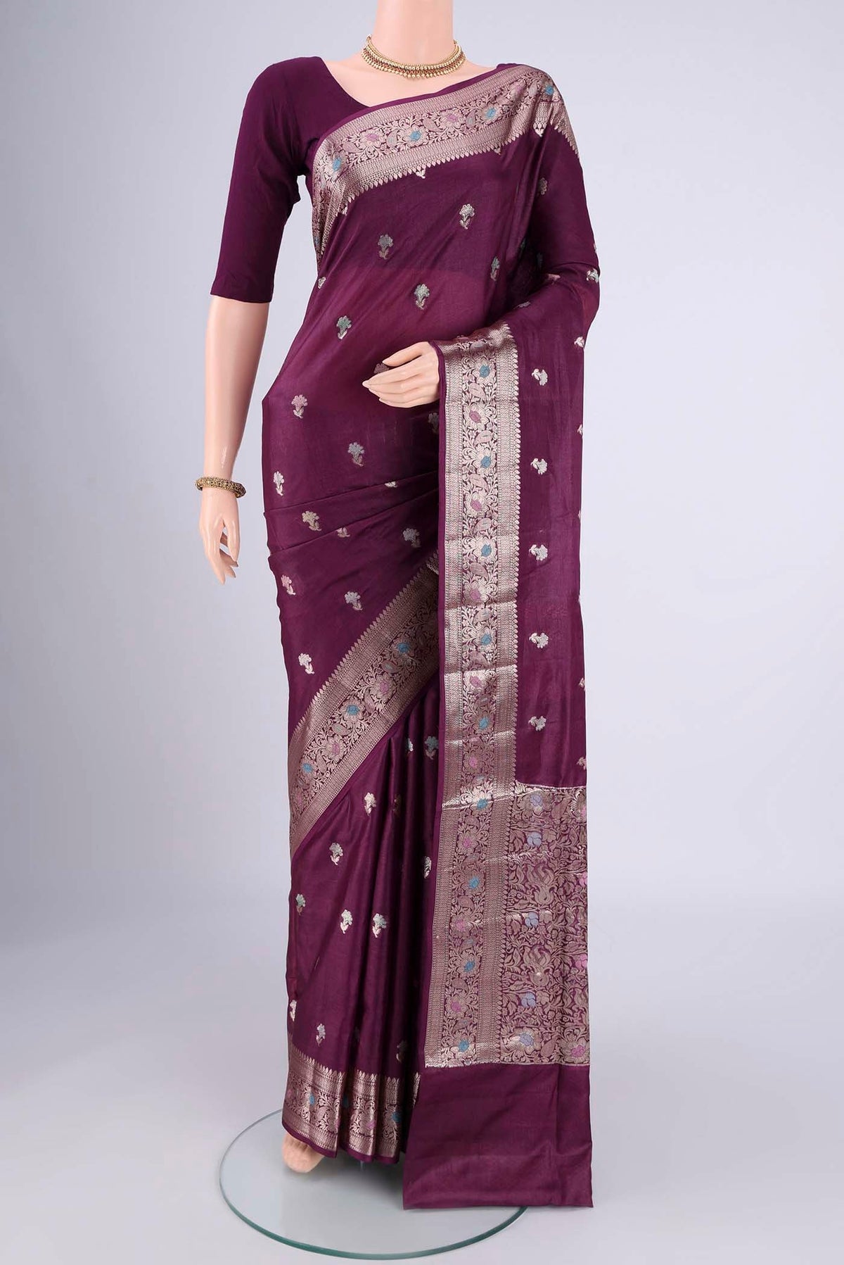 Magenta Banarasi Tussar Silk Saree with Zari And Thread Butta on the body and Zari And Thread Border.  displayed on a mannequin