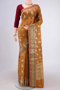 Mustard Banarasi Tussar Silk Saree with Zari Butta on the body and Zari And Thread Border.  displayed on a mannequin