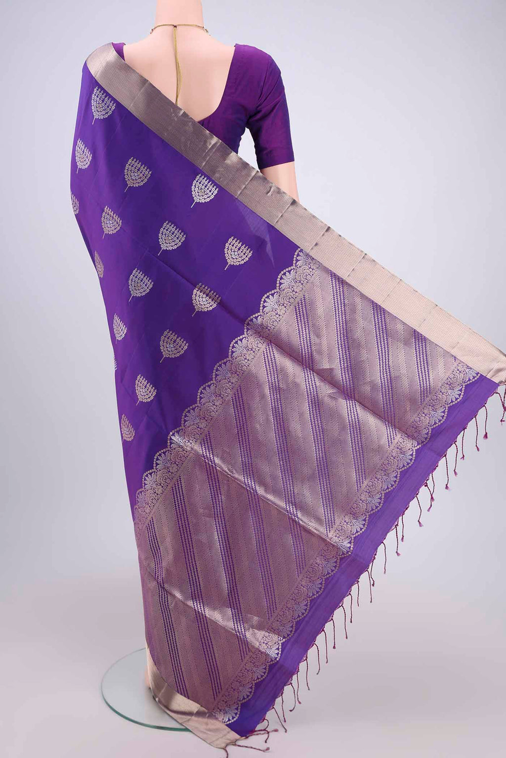 Flat view of Violet Soft Silk Saree with Zari Butta on the body and Zari Border. 