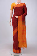 Maroon Blended Poly Cotton Saree with Checked design on the body and Thread Border.  displayed on a mannequin