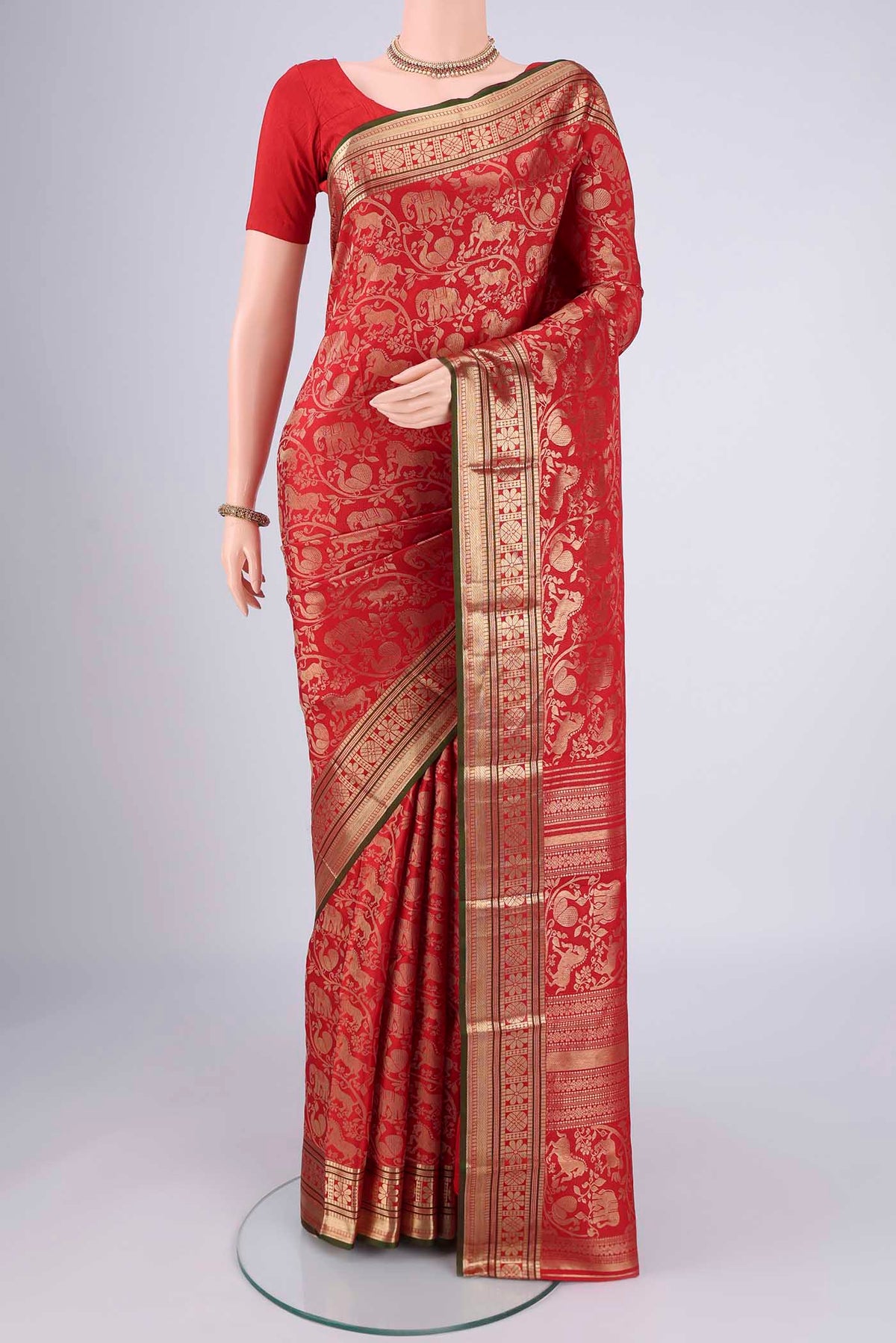 Red Dual Tone Kanchipuram Silk Saree with Zari Brocade on the body and Zari Border.  displayed on a mannequin