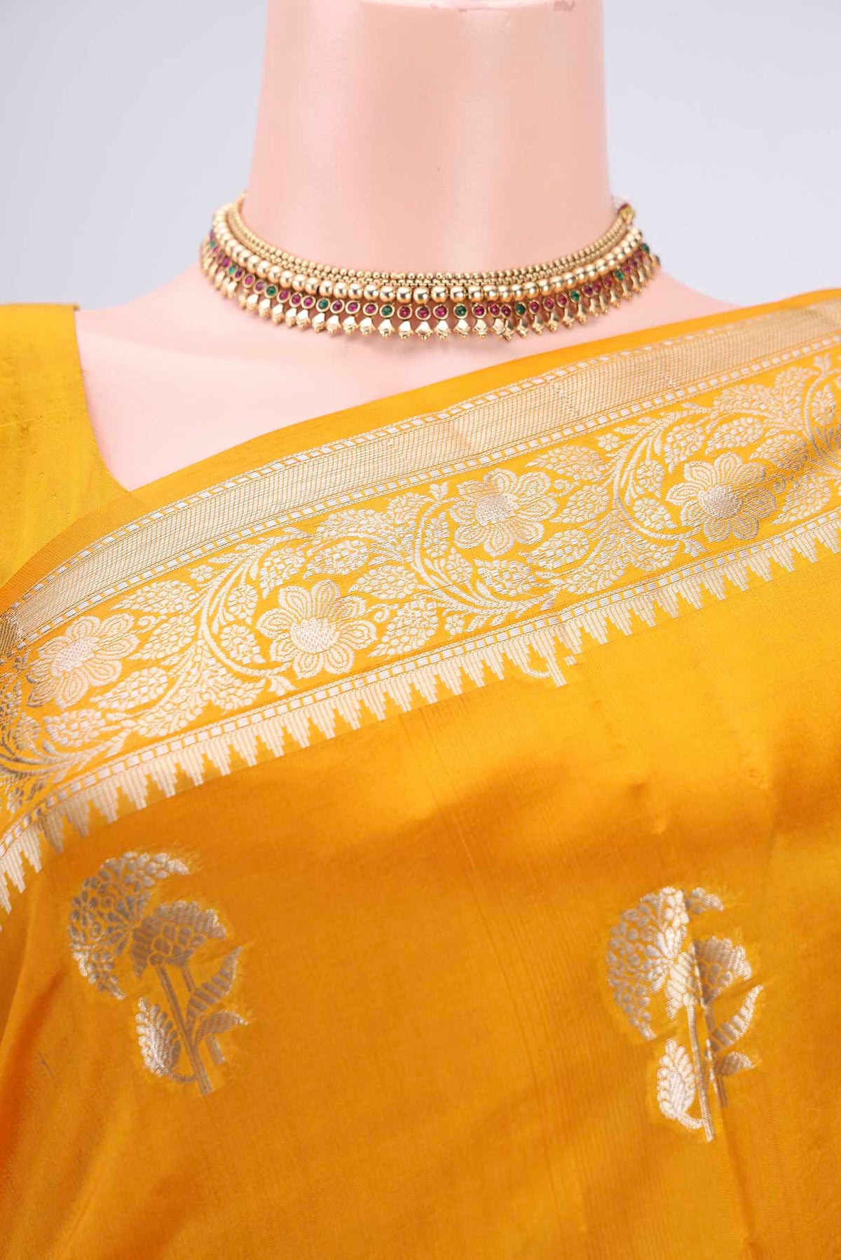Border image of Yellow Banarasi Raw Silk Saree with Zari Butta on the body and Zari Border. 