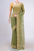 Light Green Chanderi Silk Cotton Saree with Zari Butta on the body and Zari Border.  displayed on a mannequin
