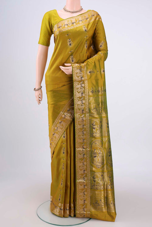Acid Green Baluchari Silk Saree with Zari And Thread Butta on the body and Zari And Thread Border.  displayed on a mannequin
