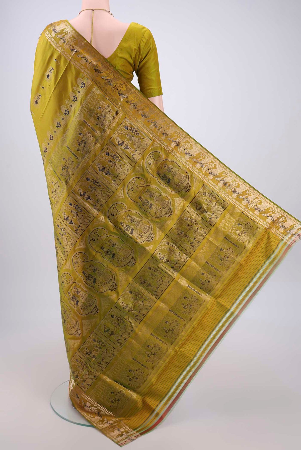 Flat view of Acid Green Baluchari Silk Saree with Zari And Thread Butta on the body and Zari And Thread Border. 
