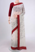 White Silk Cotton Saree with Printed design on the body and Plain Border.  displayed on a mannequin