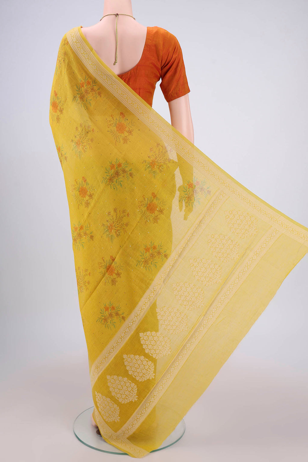 Flat view of Yellow Chanderi Silk Cotton Saree with Printed design on the body and Thread Border. 